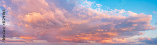 Beautiful panoramic sky with glowing clouds at sunset	