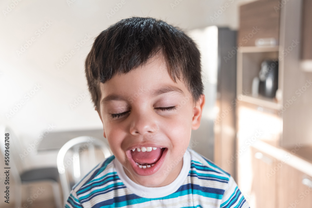 Cute and fun little boy in striped t-shirt Cute and fun little boy in striped t-shirt