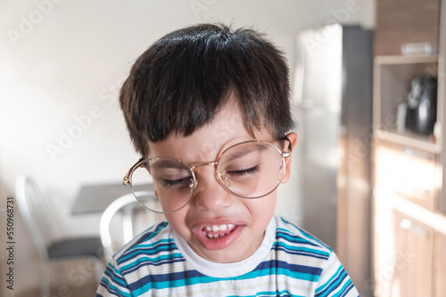 Cute boy with adult glasses