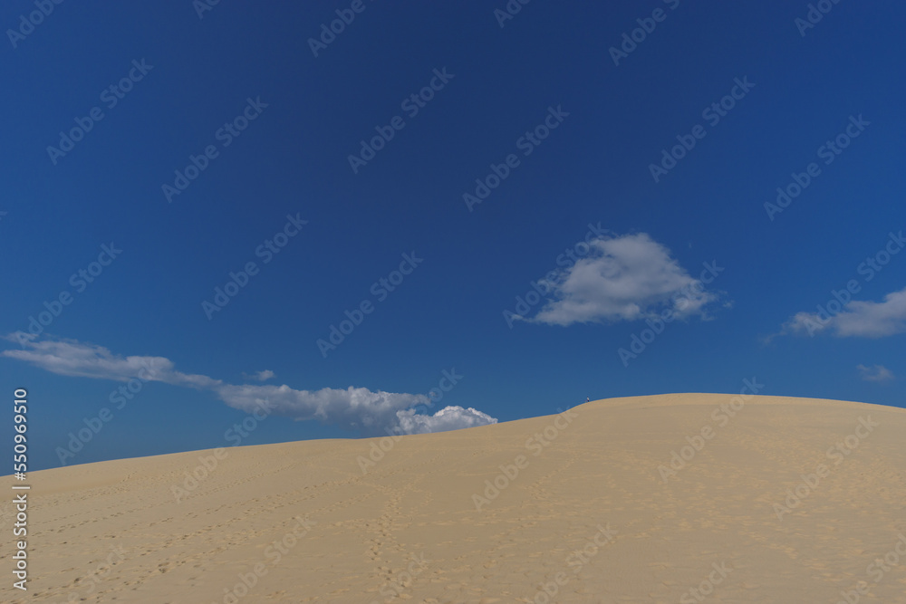 Sand dune and blue cloudy sky, Dune du Pilat, Arcachon, Nouvelle-Aquitaine, France