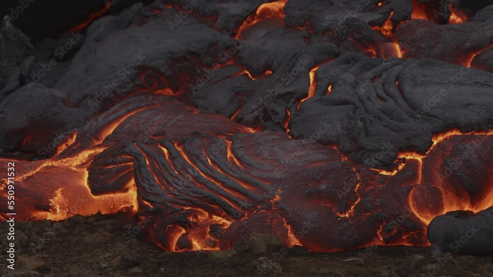 Panning shot of molten lava in volcano field / Grindavik, Reykjanes, Iceland