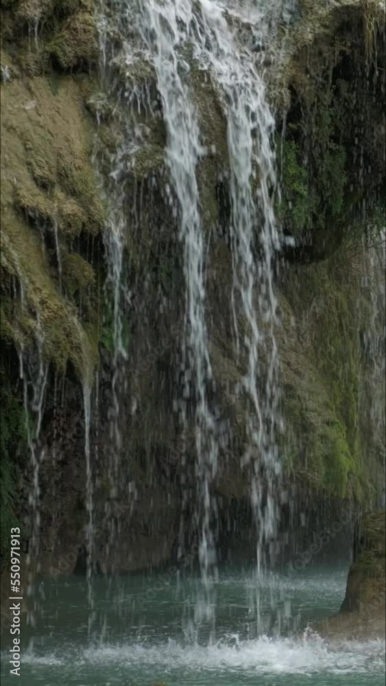 Panning steady shot, side view of a waterfalls, vertical Panning steady shot, side view of a waterfalls, vertical