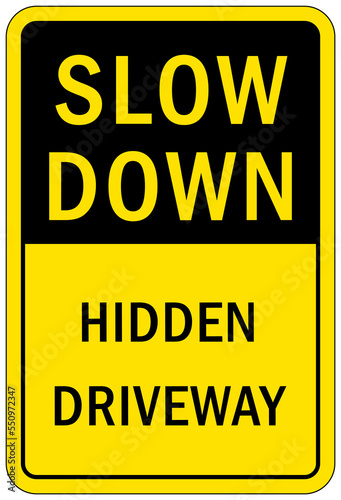 Garage sign and label slow down hidden drive