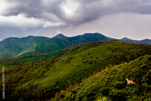 green mountains in rainny day of summer, gray clouds in the sky, sierra de guadalupe state of mexico and mexico city 