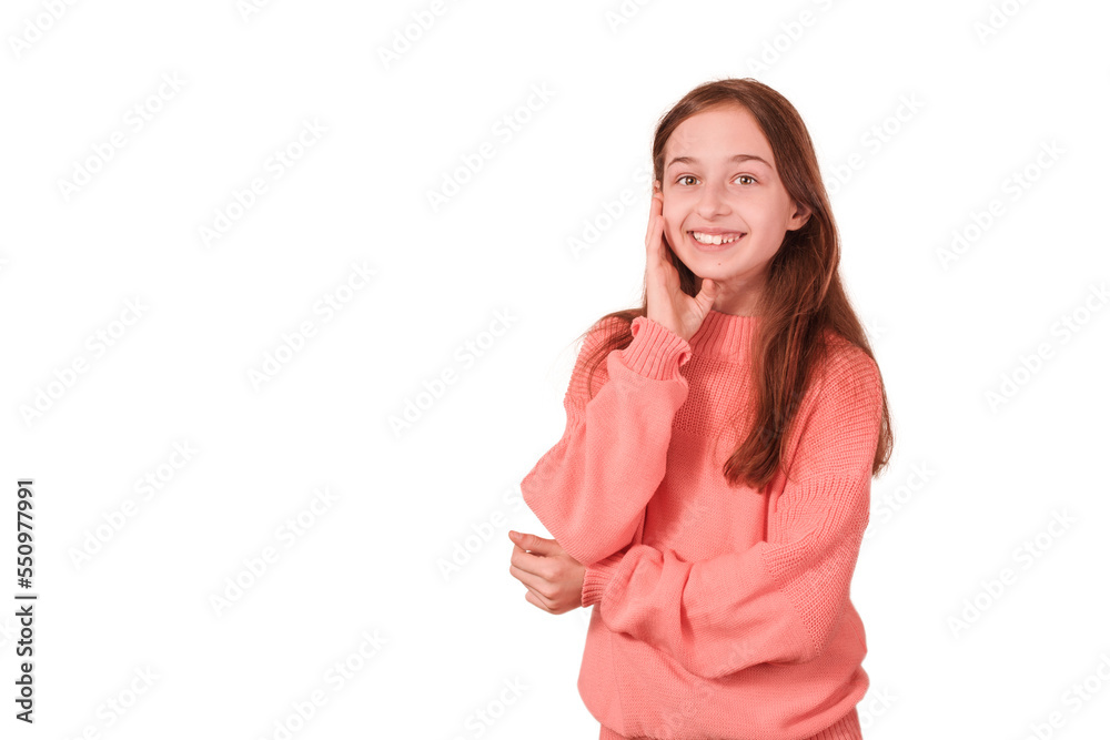 A teenage girl is smiling. Girl in pink sweater isolate on white.