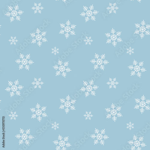 Seamless pattern with snowflakes on the blue background