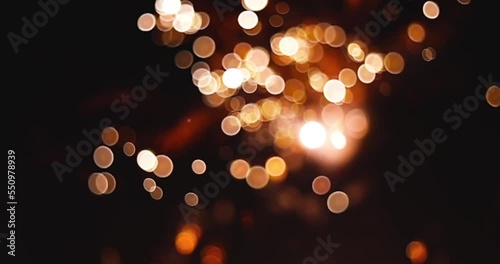 Fireworks explosion bokeh effect on black background. Festival Event, Wedding, Confetti, Christmas, Diwali, Celebration, New Year.