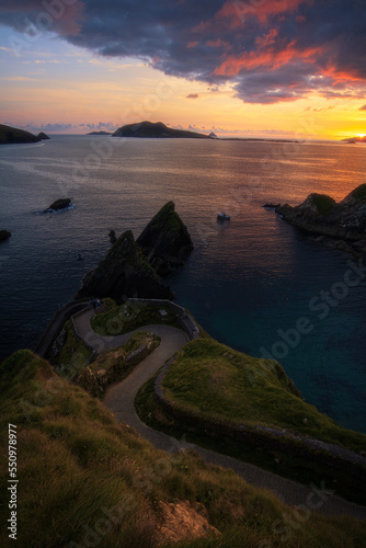 Shy Sun • Dunquin Pier, the wild link to Great Blasket Island, is watching a calm and quiet sunset.