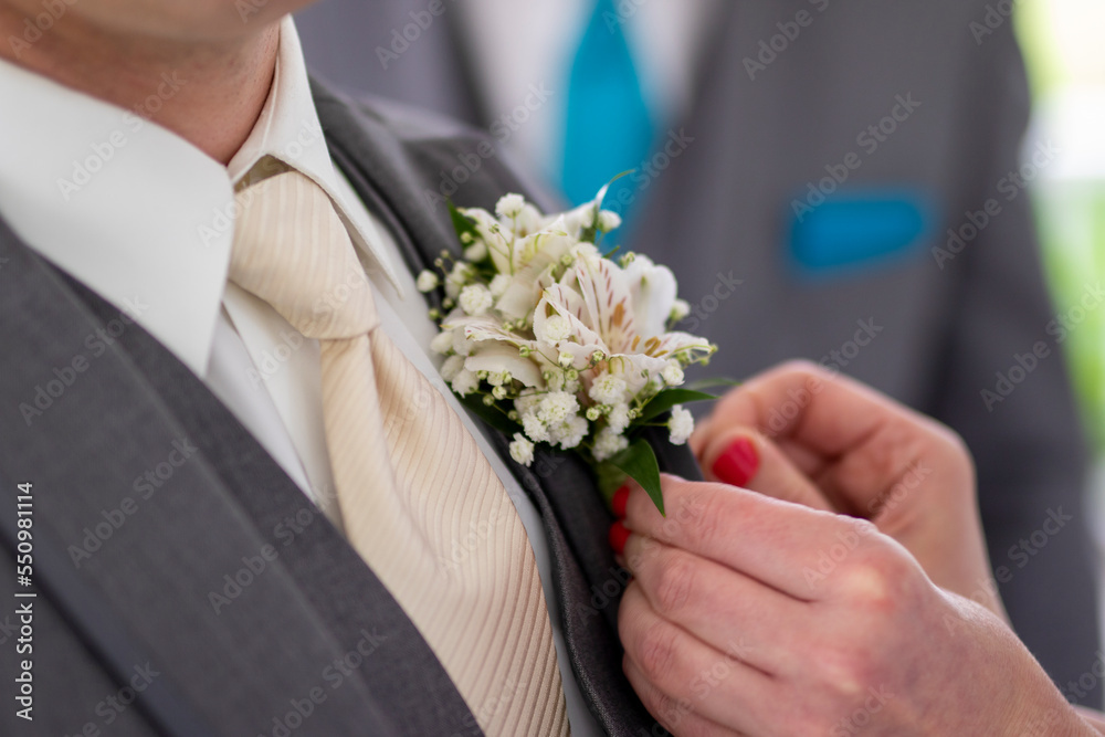 groom with wedding boutonnière groom with wedding boutonnière