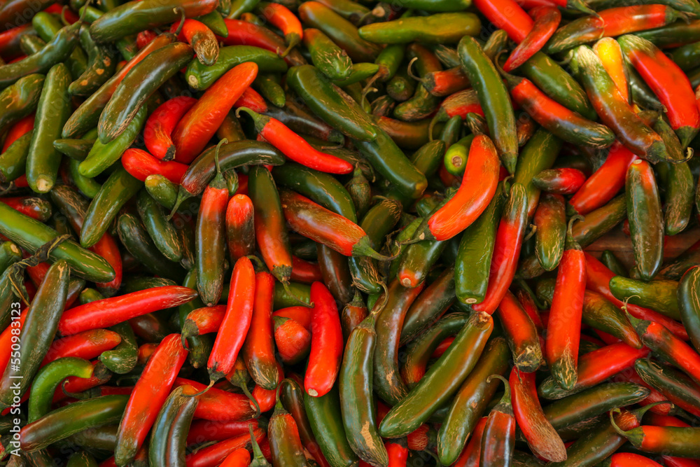 Heap of fresh Serrano peppers as background, top view Heap of fresh Serrano peppers as background, top view