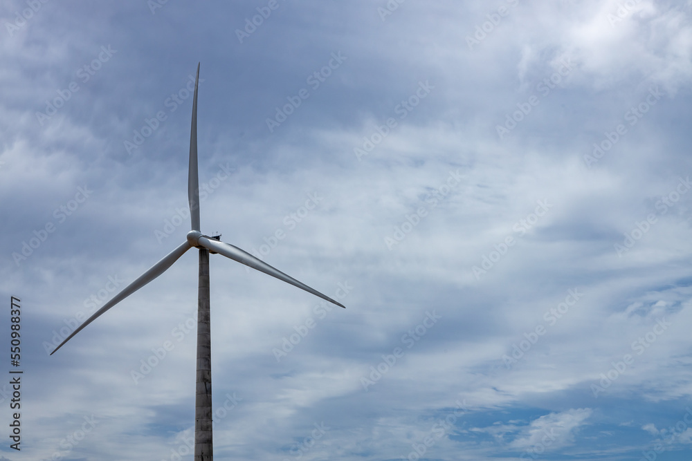 A huge electricity generator with wind with its three blades. A huge electricity generator with wind with its three blades.
