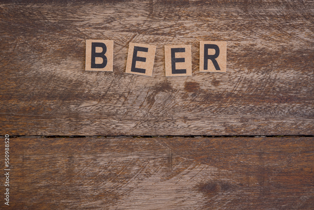 Signboard with small wooden letters with the word beer