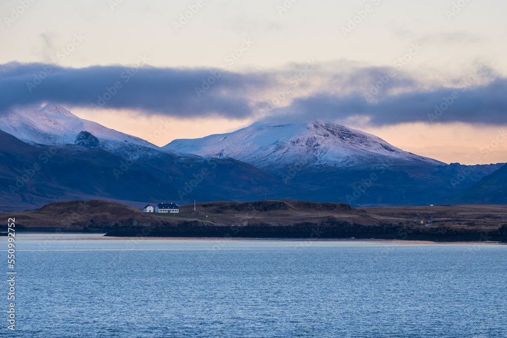 Mountains of Reykjavik bay covered with the snow at early winter twilight Mountains of Reykjavik bay covered with the snow at early winter twilight