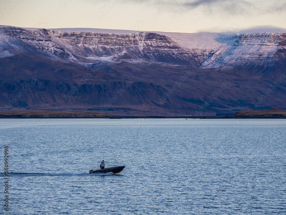 Mountains of Reykjavik bay covered with the snow at early winter twilight