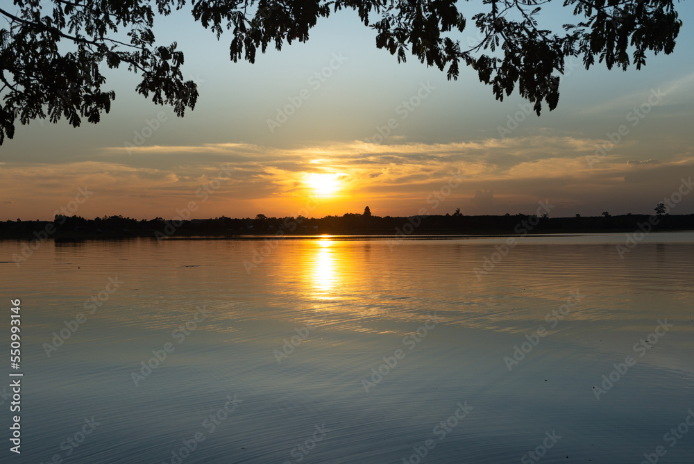 Wooden pier at sunset on a lake in Bueng Kan, Thailand 2022 Wooden pier at sunset on a lake in Bueng Kan, Thailand 2022
