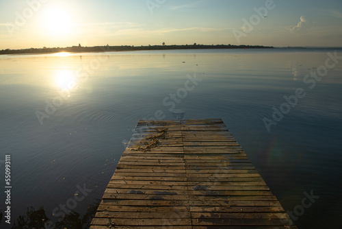 Wooden pier at sunset on a lake in Bueng Kan  Thailand 2022   
