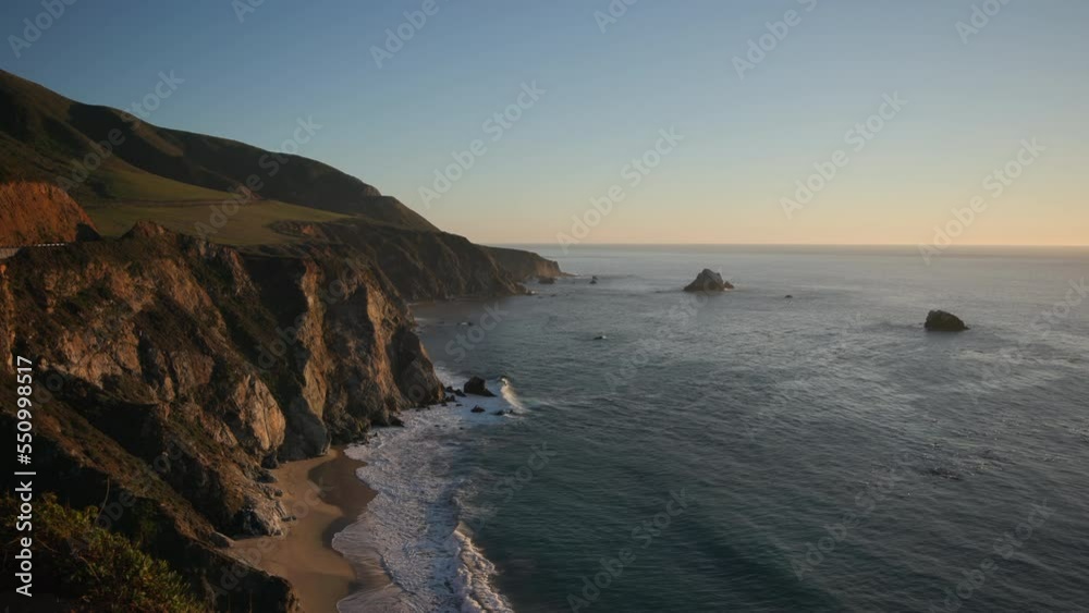 Pristine wilderness of the West Coast with cinematic ocean waves around. Spectacular view of the ocean, washing rocky cliffs with calm waters. High quality 4k footage Pristine wilderness of the West Coast with cinematic ocean waves around. Spectacular view of the ocean, washing rocky cliffs with calm waters. High quality 4k footage