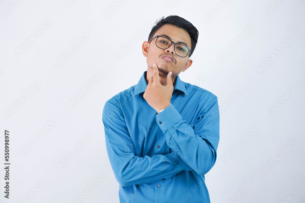 thinking asian businessman with glasses holding a chin wearing blue shirt isolated on white background thinking asian businessman with glasses holding a chin wearing blue shirt isolated on white background