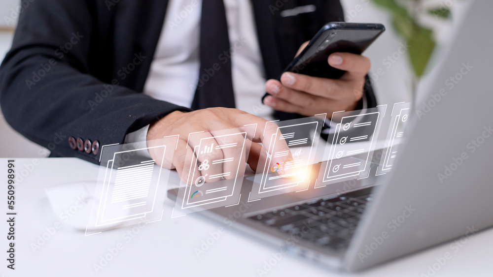 Fototapeta premium Paperless workplace ideas, e-signing, electronic signature, document management. A businessman signs an electronic document on a digital document on a virtual screen