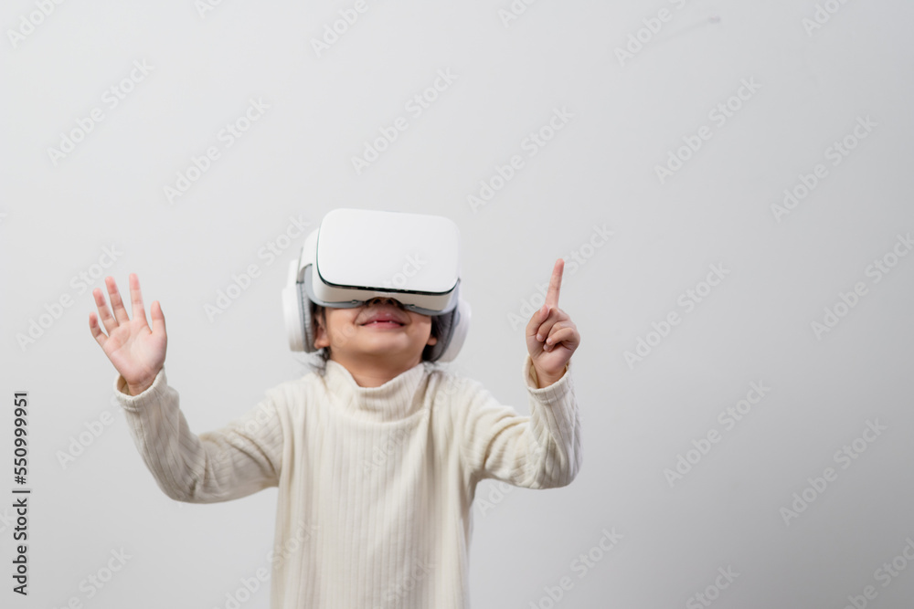 Asian little girl with virtual reality headset. Innovation technology and education concept Asian little girl with virtual reality headset. Innovation technology and education concept