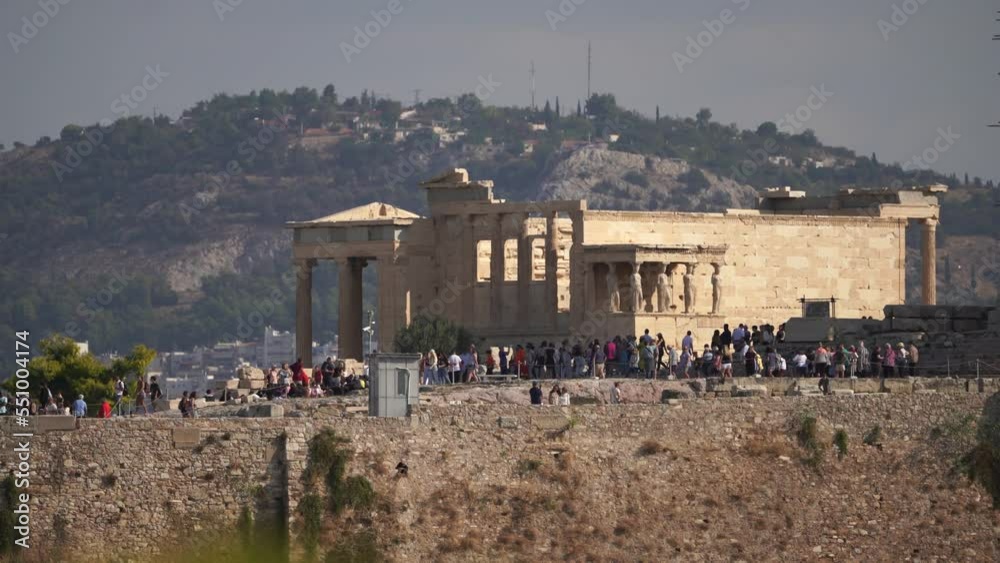 Acropolis of Athens, Greece. Many tourists in the Parthenon Temple, most Crowded place Acropolis of Athens, Greece. Many tourists in the Parthenon Temple, most Crowded place