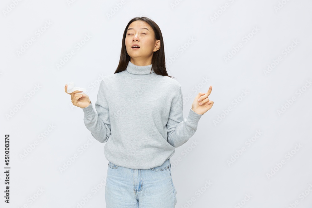 Asian woman holding hand with handkerchief and coughing up flu and cold, stuffy nose viral disease asthma and allergies covid 19 white background Asian woman holding hand with handkerchief and coughing up flu and cold, stuffy nose viral disease asthma and allergies covid 19 white background