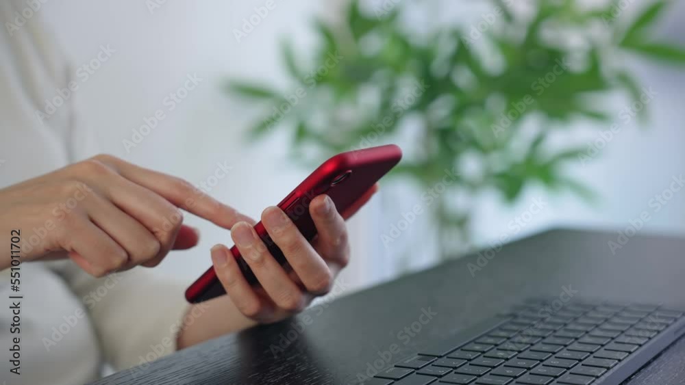 Woman using smartphone in office. mobile app.