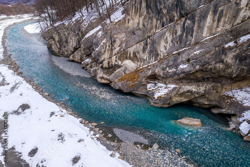 View of Ardon river in Alagir gorge on cloudy winter day. North Ossetia, Russia. photo