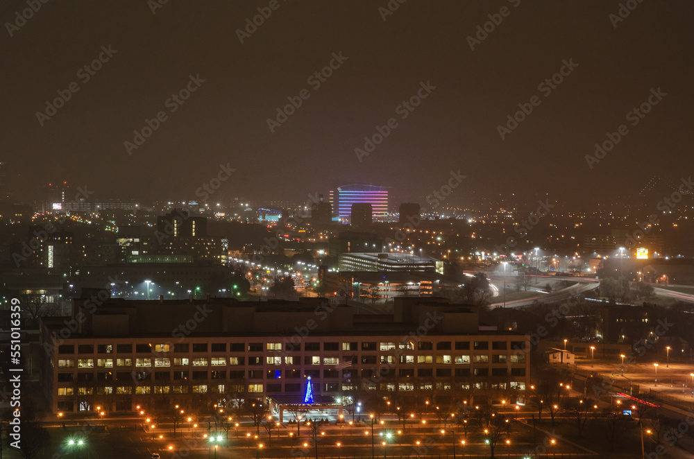View of Downtown Detroit from the Fisher Building at night on a cloudy day. View of Downtown Detroit from the Fisher Building at night on a cloudy day.