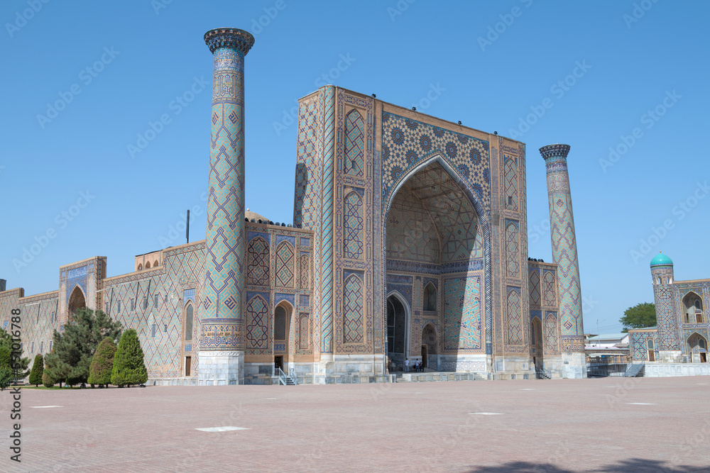 Ancient Ulugbek madrasah on a sunny day. Registan Square. Samarkand, Uzbekistan