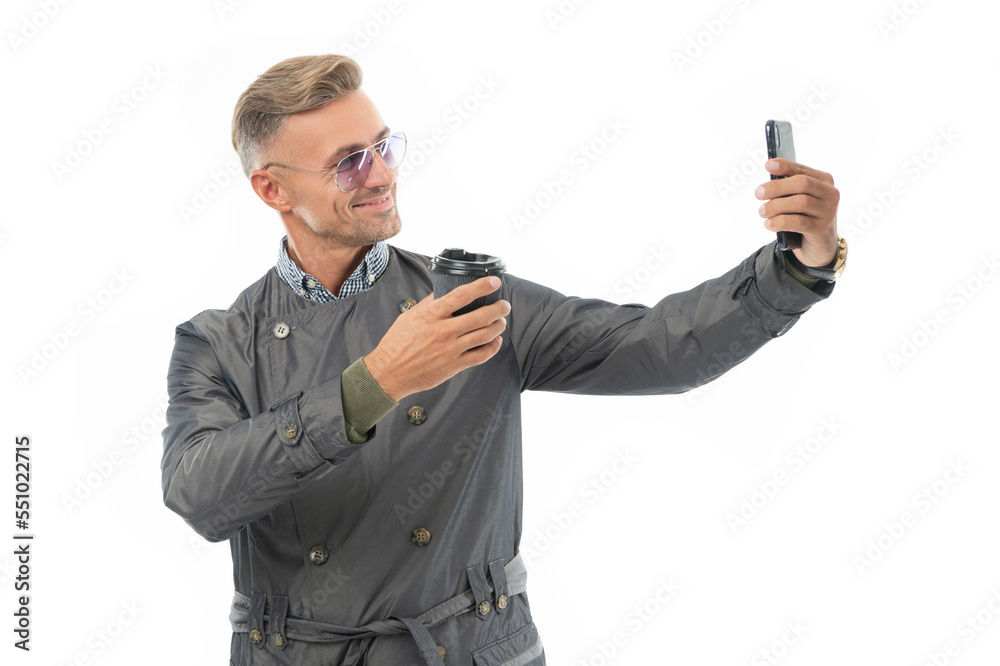 Happy smiling business man businessman boss in formal coat taking selfie on business smartphone Happy smiling business man businessman boss in formal coat taking selfie on business smartphone