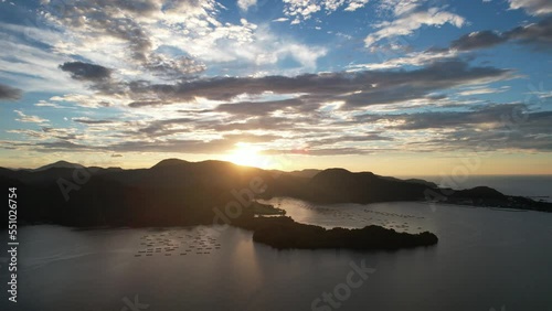 山陰海岸　京丹後市久美浜湾の綺麗な夕焼けと大明神岬　ドローン空撮　