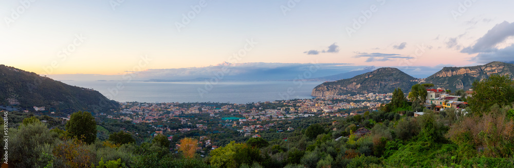 View of Touristic Town, Sorrento, Italy. Coast of Tyrrhenian Sea. Cloudy Sky Sunset. Panorama