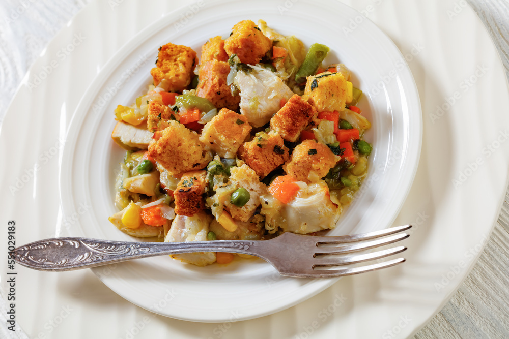 turkey pot pie with stuffing crust on plate