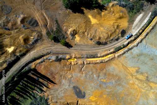 Drone aerial of copper mine with red toxic contaminated land. Environmental pollution nature contamination