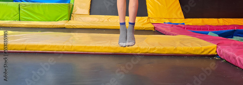 фотографія Children jumping on trampoline and having fun in park
