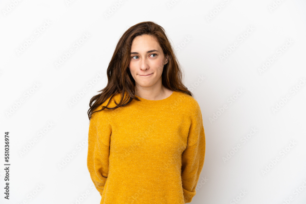 Young caucasian woman isolated on white background having doubts while looking up Young caucasian woman isolated on white background having doubts while looking up