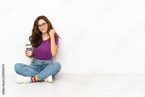 Young caucasian woman isolated on white background celebrating a victory