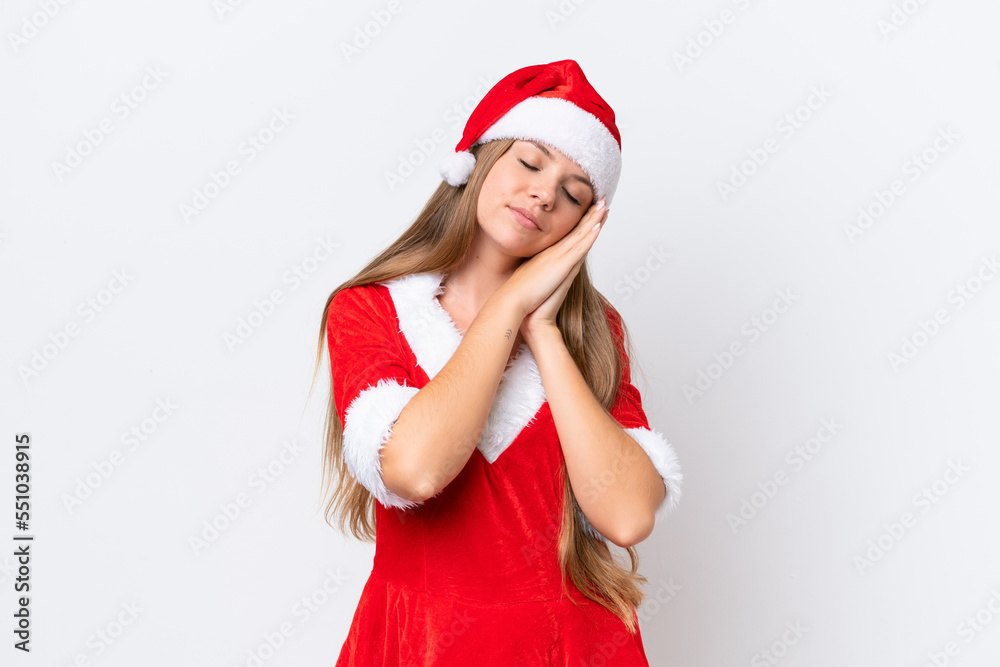 Young caucasian woman dressed as mama noel isolated on white background making sleep gesture in dorable expression Young caucasian woman dressed as mama noel isolated on white background making sleep gesture in dorable expression