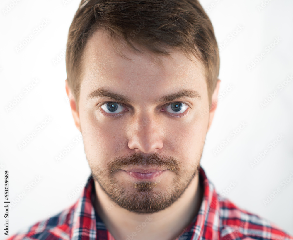 Obraz premium Portrait of a sad man with blue eyes. Selective focus.