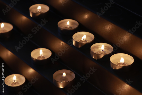 Many burning candles in the church