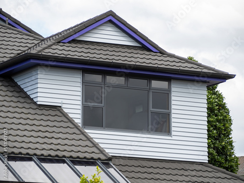 Photography Dutch gable roof dormer loft with window.