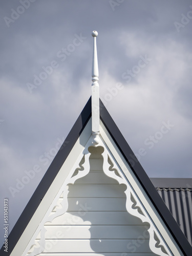 Gable roof with finial and carved fascia