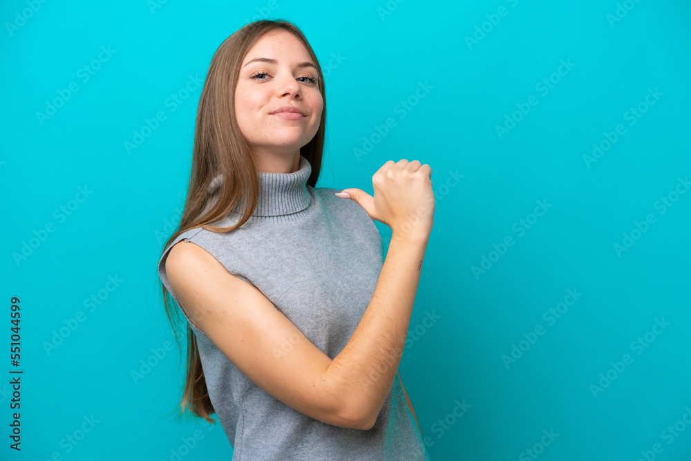 Fototapeta premium Young Lithuanian woman isolated on blue background proud and self-satisfied