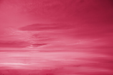 Acrylglasbilder Pantone 2023 Viva Magenta Trendy color of the year 2023. Sky with rain clouds toned in viva magenta color.sky abstract background, beautiful cloudscape, on the heaven, view over white fluffy clouds, freedom concept  © Yulia