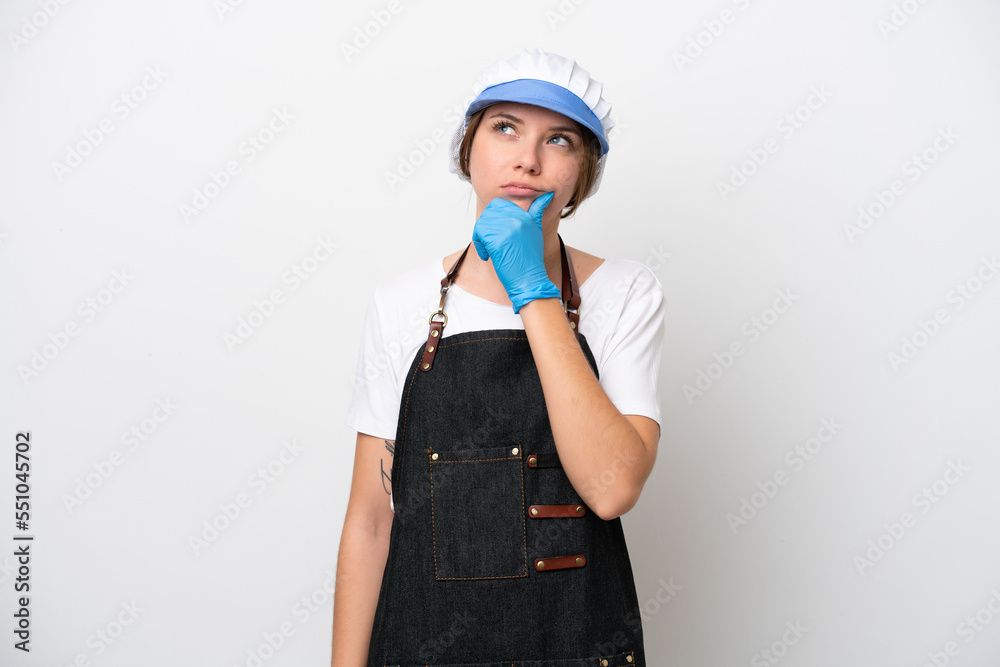 Fishmonger woman wearing an apron having doubts
