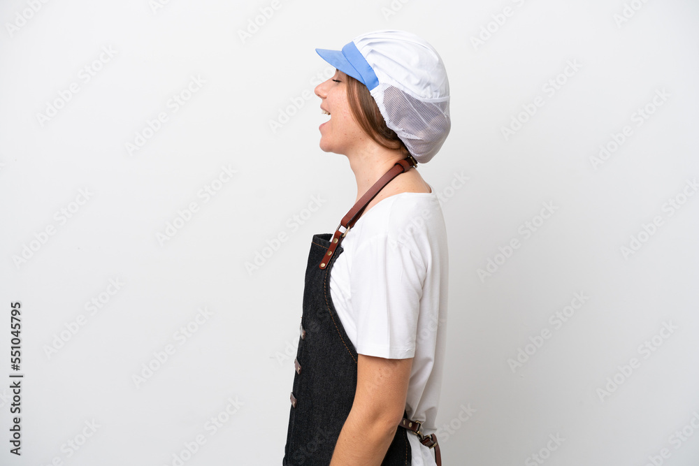 Fishmonger woman wearing an apron laughing in lateral position Fishmonger woman wearing an apron laughing in lateral position