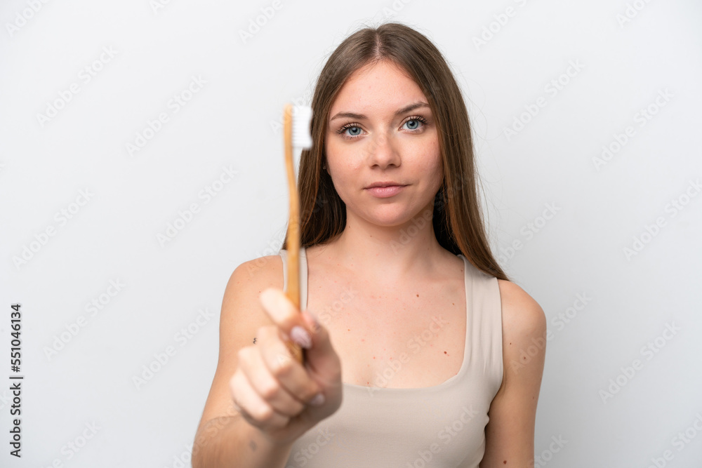 Young Lithuanian woman isolated on white background with a toothbrush Young Lithuanian woman isolated on white background with a toothbrush