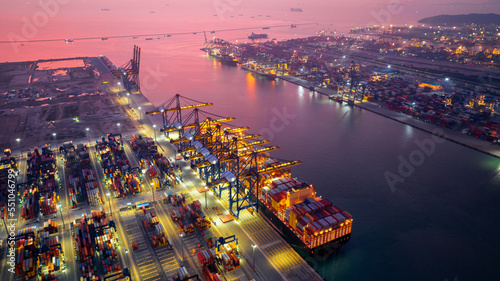 Fotografia, Obraz Aerial view of cargo ship and cargo container in harbor.