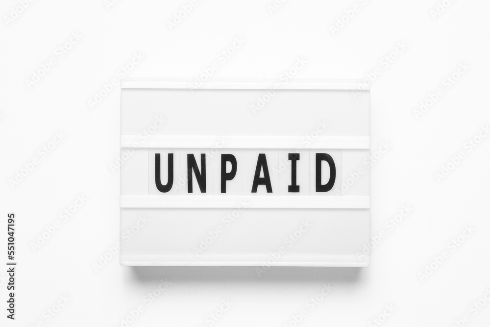 Lightbox with word unpaid on white background. Business and finance concept Lightbox with word unpaid on white background. Business and finance concept